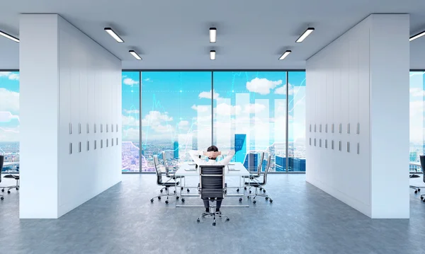 Man relaxing at meeting table