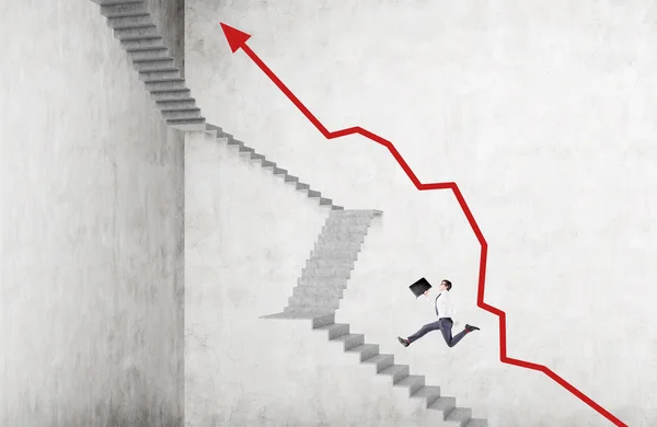 Businessman with case running up steep stairs, red graph along it. Concrete background. Concept of career growth.