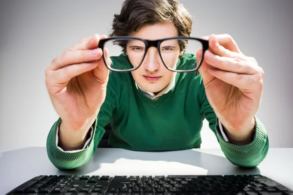 Man looking through glasses