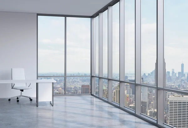 Work space in a modern panoramic corner office in New York.