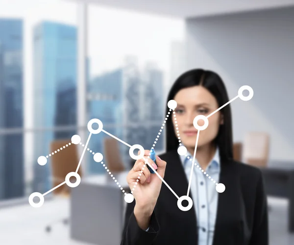 A business lady is drawing fluctuation of the financial chart on the glass screen. Office view with Singapore view in blur on the background.