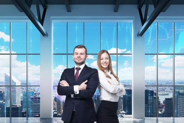 Couple of young managers are standing in the modern panoramic office. New York view. Financial charts are drawn over the panoramic windows.