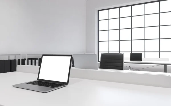 Workplaces in a bright modern loft open space office. Tables equipped with laptops, white copy space in the screen. Docs shelves. White copy space in the panoramic windows. 3D rendering.