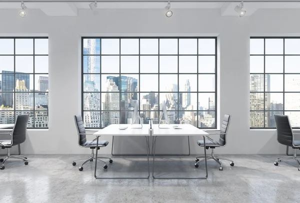 Workplaces in a bright modern loft open space office. Tables are equipped with modern computers. New York panoramic view. A concept of a high quality professional consulting services. 3D rendering.