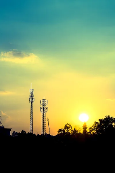 Sunset sky with silhouette antenna