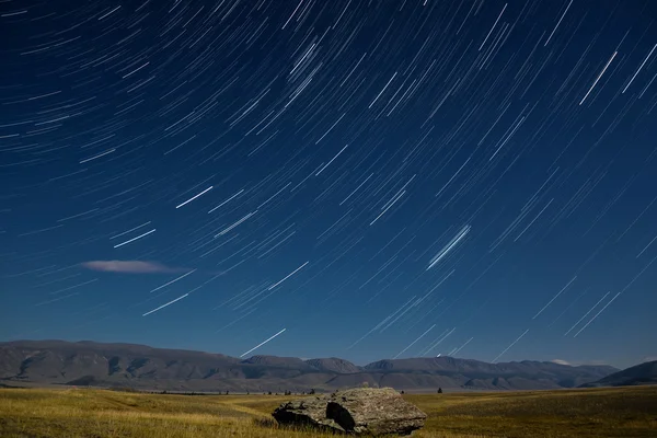 Mountains star tracks cloud sky