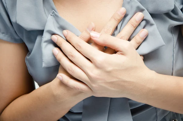 Close up woman having chest pain breast pain