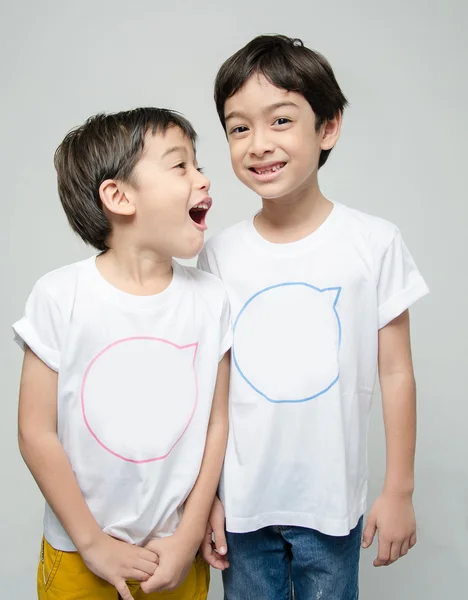 Little sibling boy in white shirt together