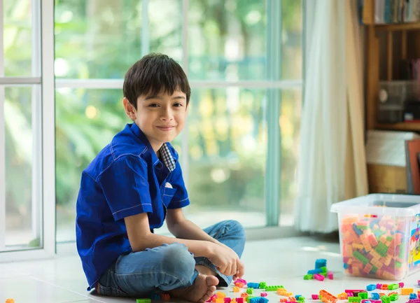 Little boy playing block indoor house education
