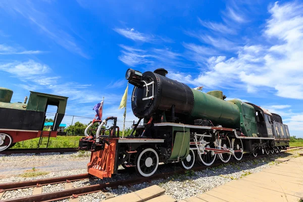 Antique steam trains in the station with blue sky background