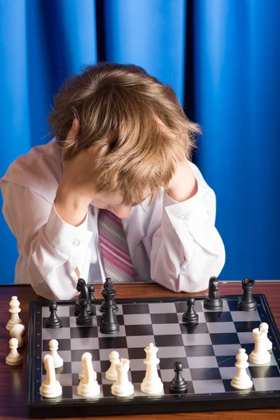 Boy playing chess