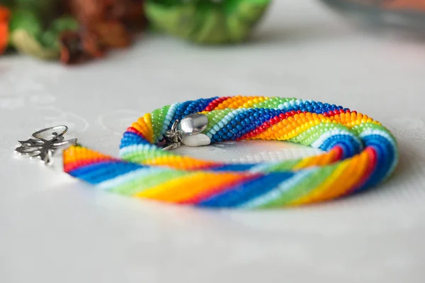 Crochet necklace made from seed beads rainbow colors