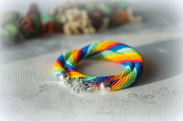 Crochet necklace made from seed beads rainbow colors