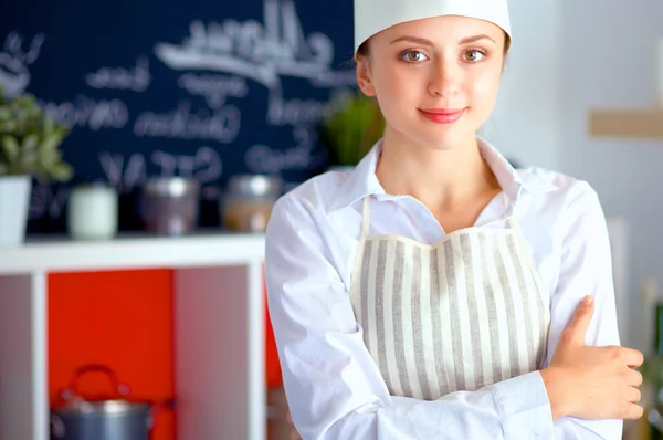 Chef woman portrait with  uniform in the kitchen