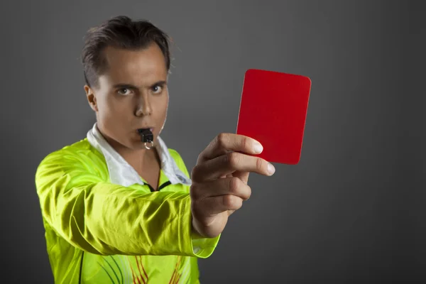 Soccer referee showing the red card