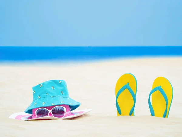 Sandal footware, straw hat, and sun glasses