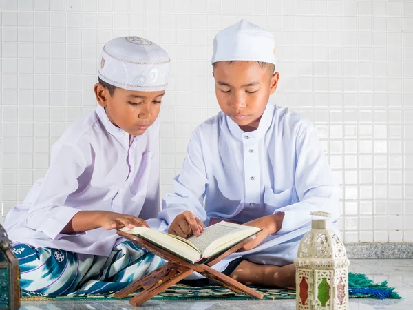 Asian muslim children with smile face read the holy Quran