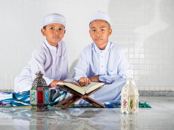 Asian muslim children with smile face read the holy Quran