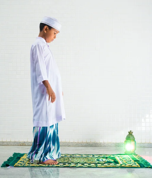 Muslim child worships and prays for Allah
