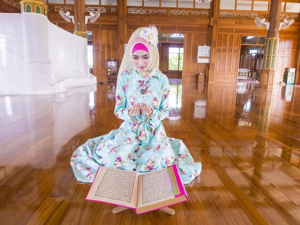 Young muslim woman praying for Allah