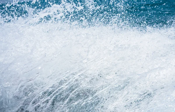 Splash of the clear sea water in high speed photo