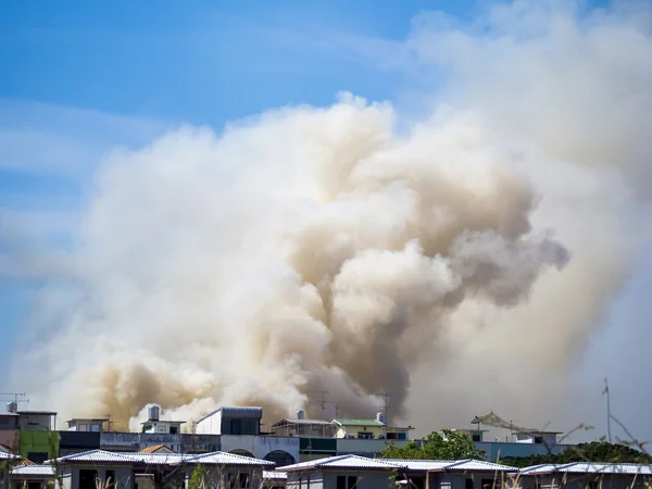 Burning house causes a big pile of smoke