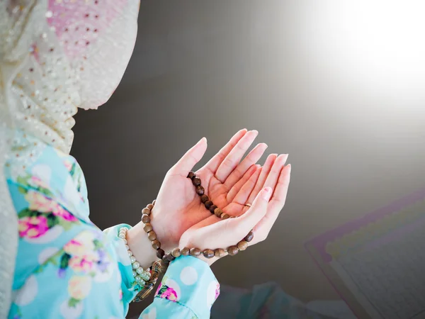 Young muslim woman praying for Allah