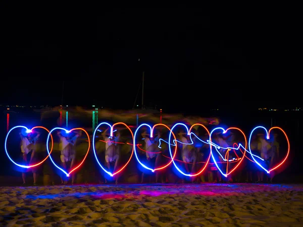 LED light source painting in the sea shore
