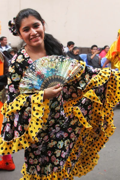 Women With Flowered Dress and Fan in Carnival Parade