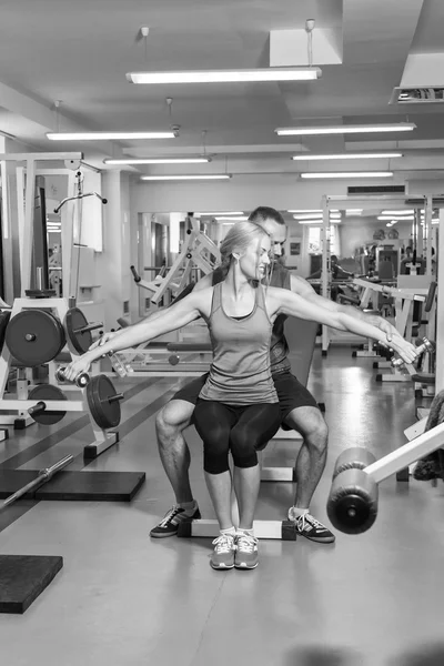 Sport couple on training in the gym.