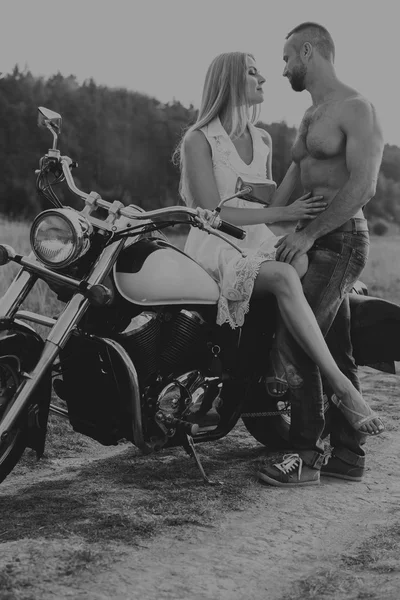 Black and white photo biker couple on a motorcycle in the field. | Stock  Images Page | Everypixel