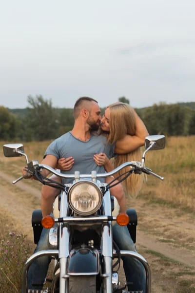 Beautiful couple in love at mototsikle.