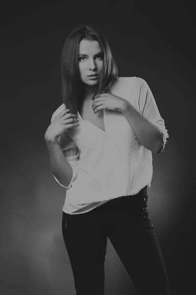 Elegant girl in white blouse, black-and-white photo