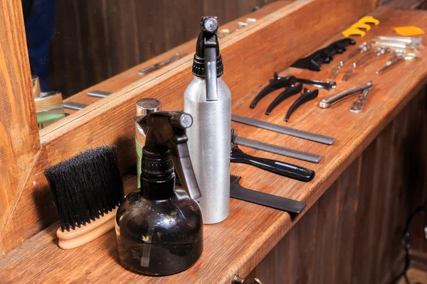 Tools hairdressers. Barber Tools on a wooden background