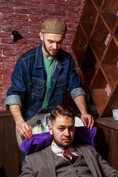 Cleaning head Barbershop. Cleaning head barber\'s. Barber washing head client. Hairdressers wash head to the client.
