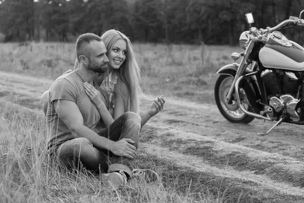 Travel and love, passion, bike road. Couple in love on the road with a motorcycle. Boy and girl in love.