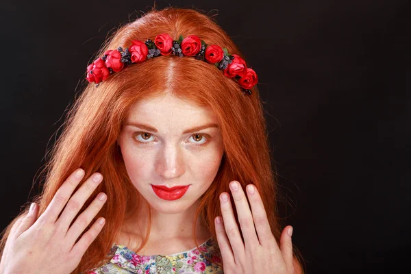 Beautiful red-haired girl with a wreath in her hair. Accessories for hair - wreaths. Hair ornaments. Gorgeous red-haired girl.