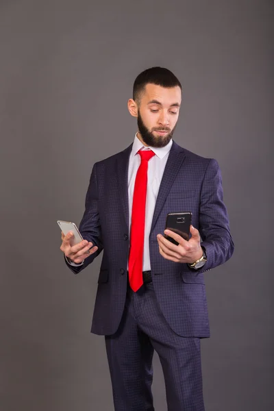 Young successful man with a mobile phone