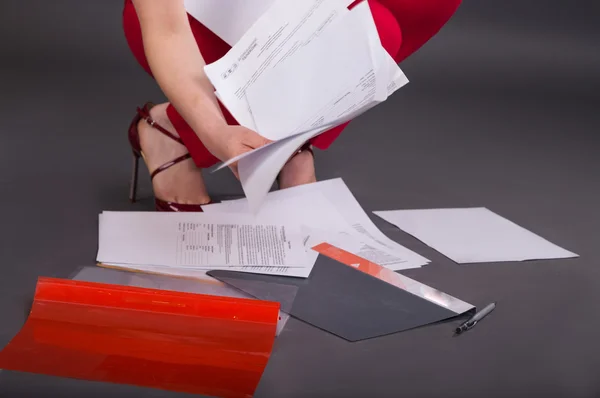 Business woman with colored folders and papers