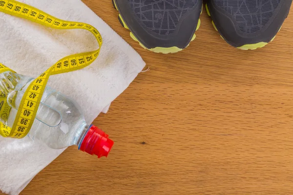 Boxing gloves, a towel and water. All fitness