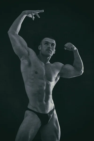 Muscular torso of sexy young male bodybuilder