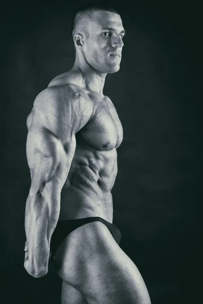 Muscular torso of sexy young male bodybuilder