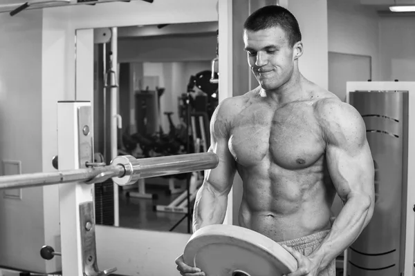 Fit man exercising at the gym.