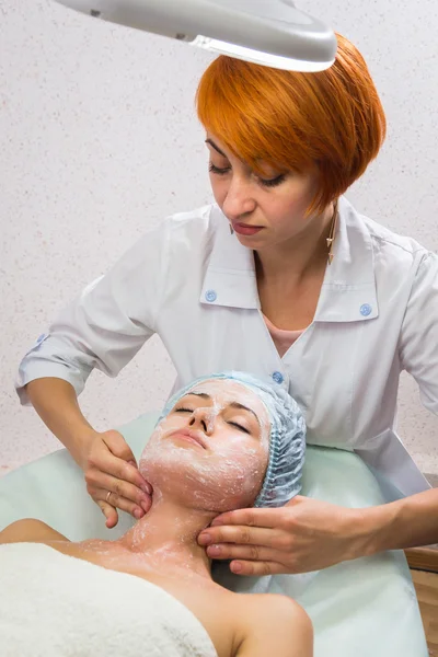 Beautiful woman with facial mask