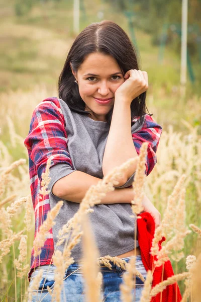 Girl in casual clothing in high grass