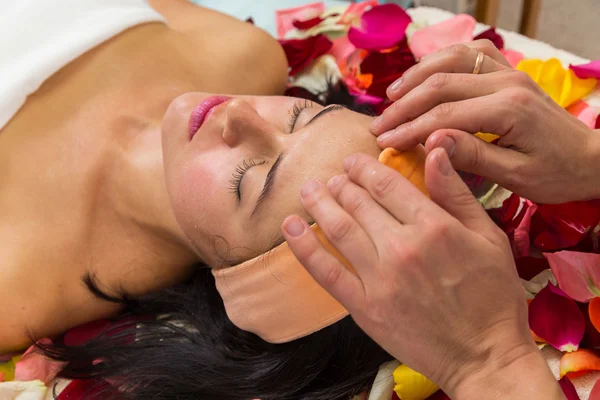 Girl taking facial massage