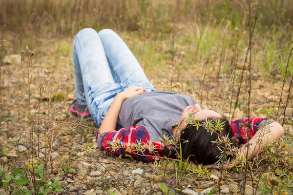 Brunette woman in casual clothes on nature