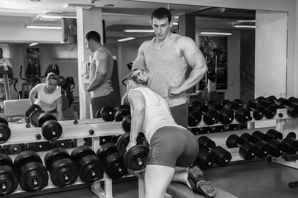 Sporty man and woman working out