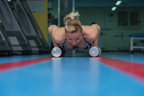 Girl with dumbbells