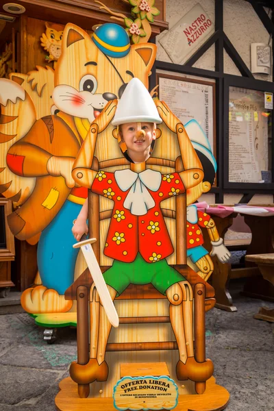 Boy face in Pinocchio cutout figure